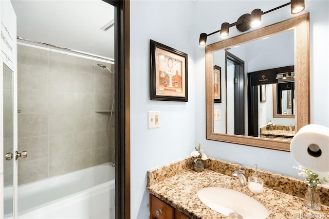 7780 W 38th Ave Unit 203, Wheat Ridge, CO 80033 - bathroom featuring vanity and shower / bath combination