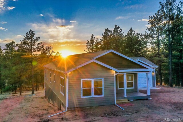 view of back house at dusk