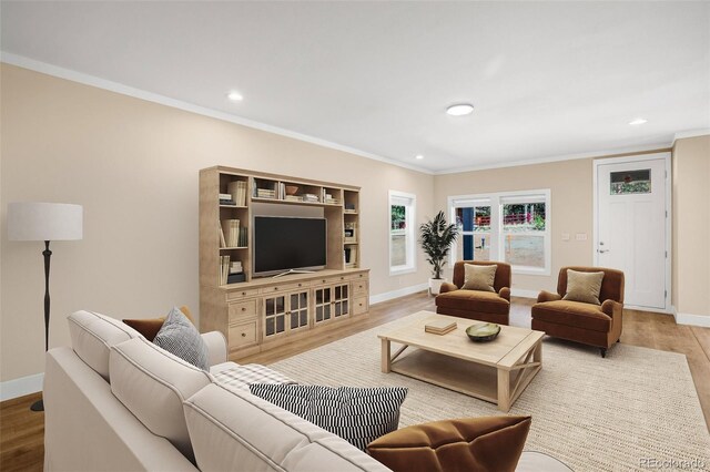 living room featuring ornamental molding and hardwood / wood-style floors