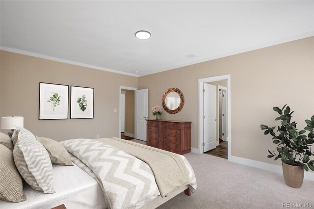 carpeted bedroom featuring ornamental molding