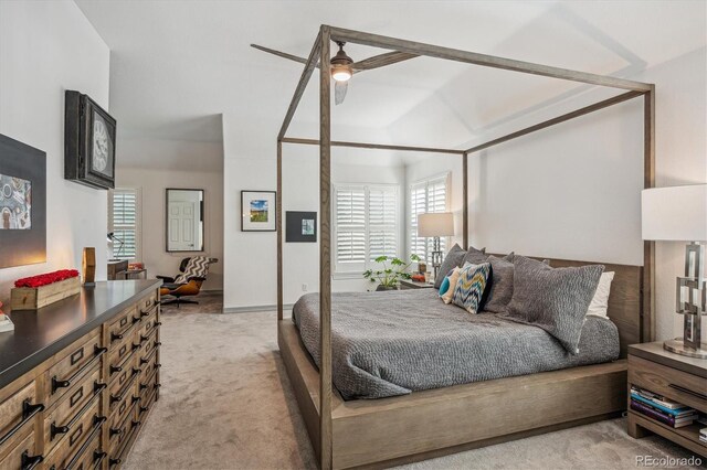 bedroom featuring light colored carpet and multiple windows