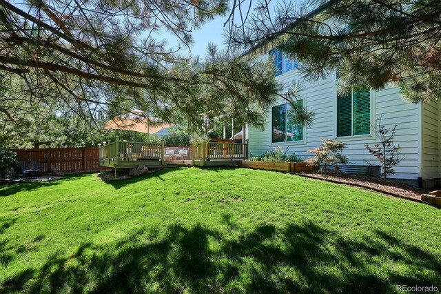 view of yard featuring a deck