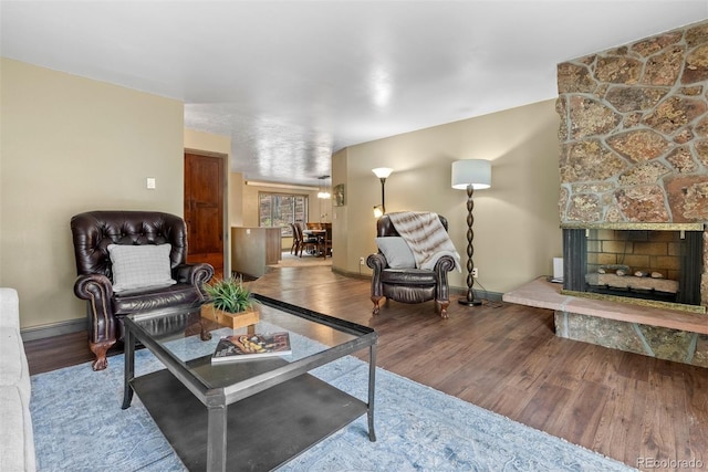 living room featuring hardwood / wood-style floors and a fireplace