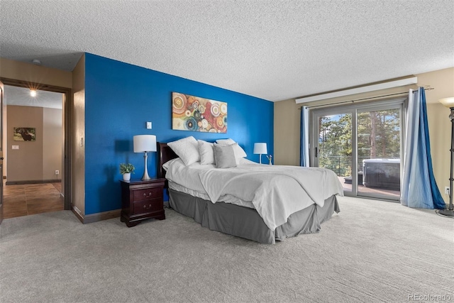 bedroom with light colored carpet, access to exterior, and a textured ceiling