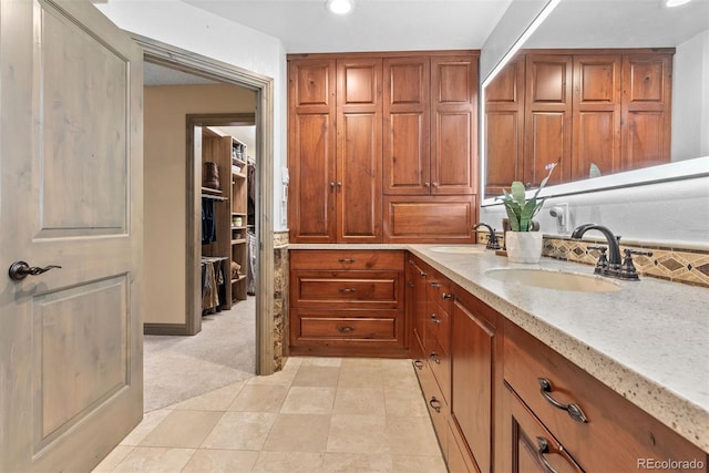 bathroom with vanity and decorative backsplash