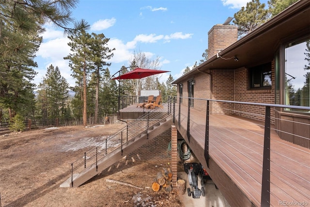 view of home's exterior with a wooden deck