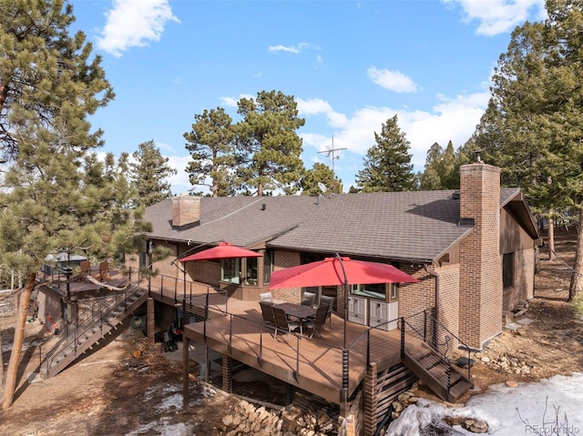 back of house with a wooden deck