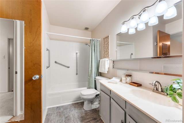 full bathroom featuring shower / tub combo, backsplash, vanity, and toilet