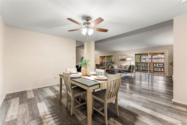 dining area featuring a baseboard heating unit, hardwood / wood-style floors, and ceiling fan