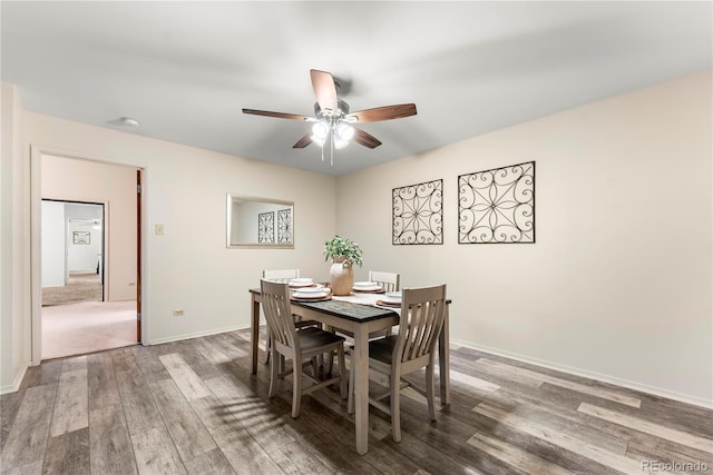 dining room featuring hardwood / wood-style floors and ceiling fan