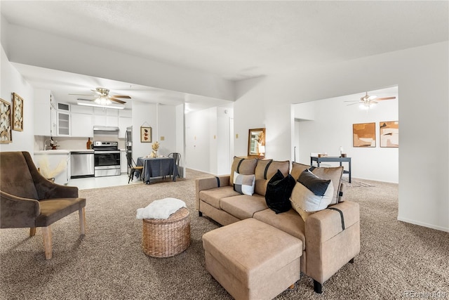 living room featuring sink and carpet