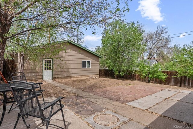 back of property featuring a patio area and a fenced backyard