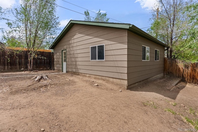 view of property exterior with fence