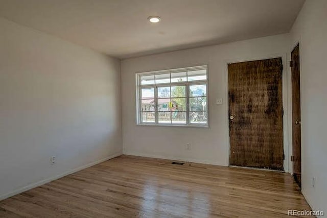 unfurnished room featuring light hardwood / wood-style flooring