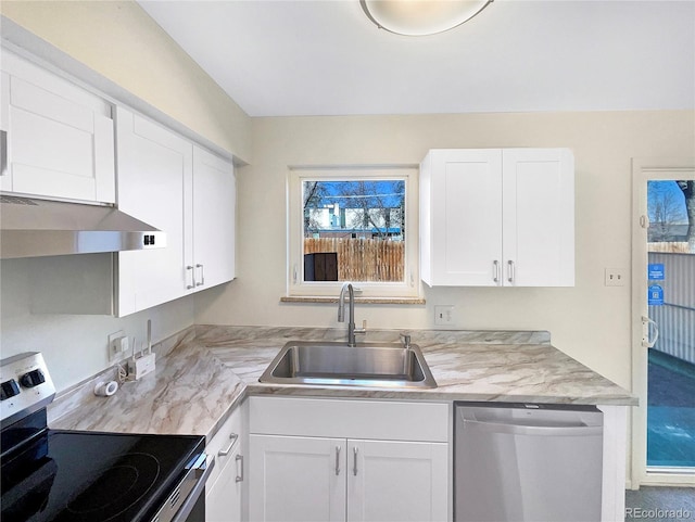 kitchen featuring under cabinet range hood, light countertops, appliances with stainless steel finishes, white cabinets, and a sink