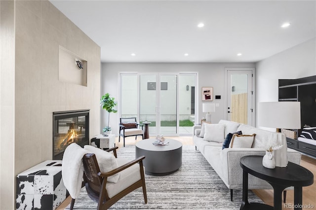 2520 S Cherokee St, Denver, CO 80223 - living room with a glass covered fireplace, recessed lighting, and wood finished floors