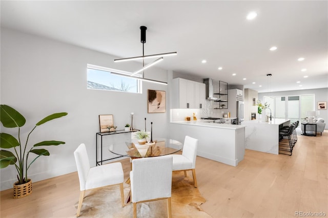 2520 S Cherokee St, Denver, CO 80223 - dining space with recessed lighting, a notable chandelier, and light wood-style floors