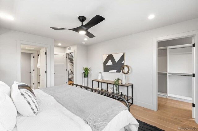 2520 S Cherokee St, Denver, CO 80223 - bedroom with recessed lighting, a spacious closet, a closet, and wood finished floors