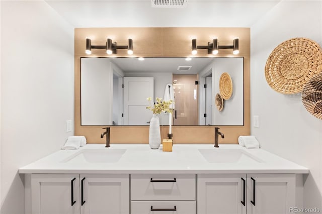 2520 S Cherokee St, Denver, CO 80223 - full bathroom with double vanity, visible vents, and a sink