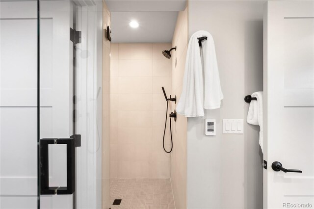 2520 S Cherokee St, Denver, CO 80223 - bathroom featuring a tile shower and recessed lighting