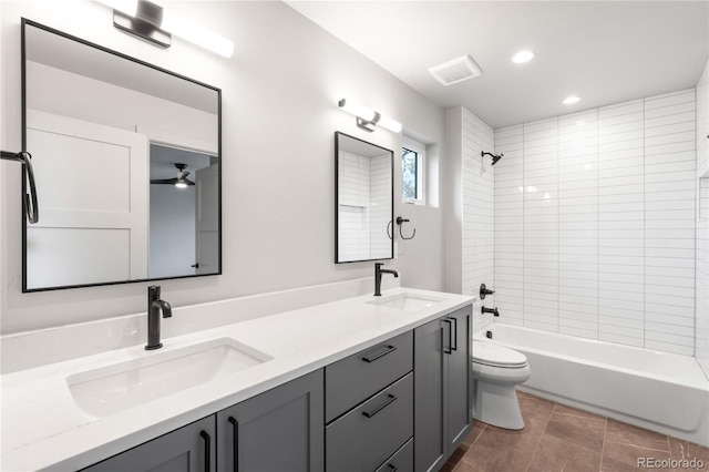 2520 S Cherokee St, Denver, CO 80223 - bathroom featuring a sink, double vanity, toilet, and bathing tub / shower combination
