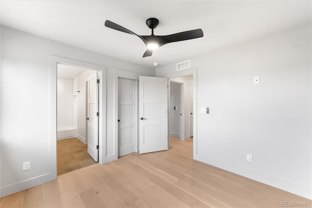 2520 S Cherokee St, Denver, CO 80223 - unfurnished bedroom with light wood finished floors, connected bathroom, visible vents, baseboards, and ceiling fan