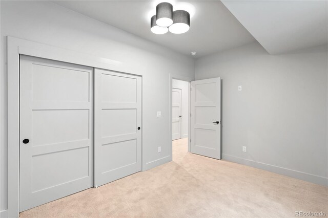 2520 S Cherokee St, Denver, CO 80223 - unfurnished bedroom featuring baseboards, light carpet, and a closet