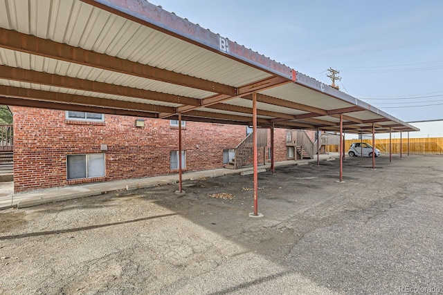 view of parking / parking lot featuring a carport