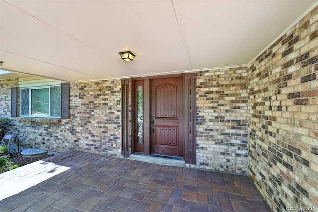 802 Altair Dr, Littleton, CO 80124 - doorway to property featuring brick siding