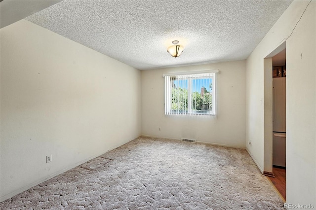 802 Altair Dr, Littleton, CO 80124 - spare room featuring a textured ceiling and carpet