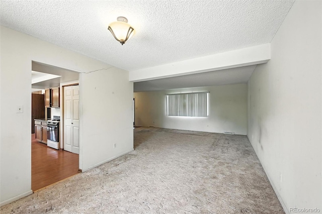 802 Altair Dr, Littleton, CO 80124 - carpeted empty room featuring a textured ceiling