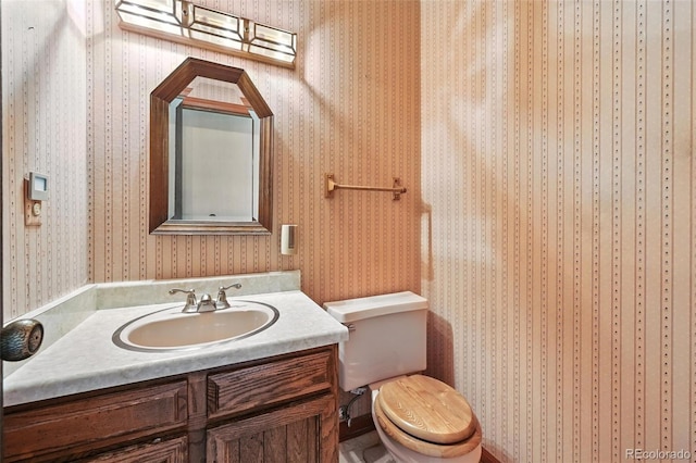 802 Altair Dr, Littleton, CO 80124 - bathroom featuring vanity and wallpapered walls