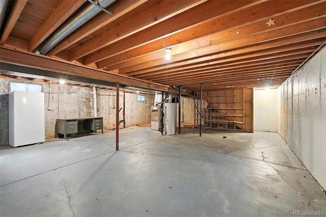 802 Altair Dr, Littleton, CO 80124 - unfinished below grade area with freestanding refrigerator and gas water heater