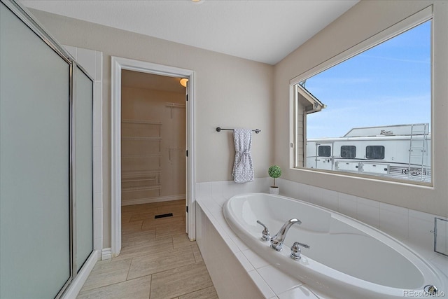 bathroom with plus walk in shower