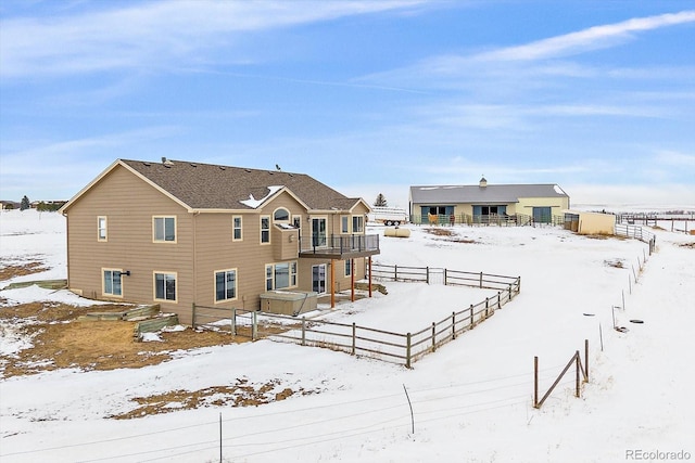 view of snow covered house