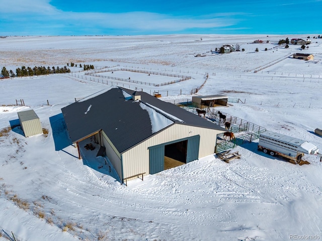 snowy aerial view with a rural view