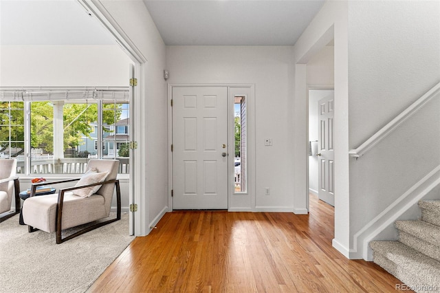 foyer entrance featuring plenty of natural light and wood-type flooring