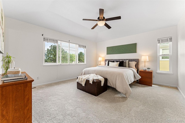 bedroom with ceiling fan and light carpet