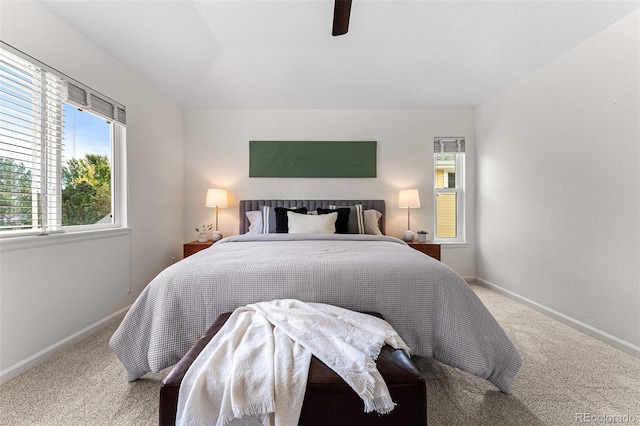 carpeted bedroom featuring ceiling fan