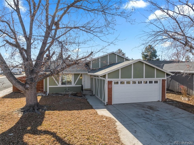 mid-century inspired home with concrete driveway, brick siding, and an attached garage