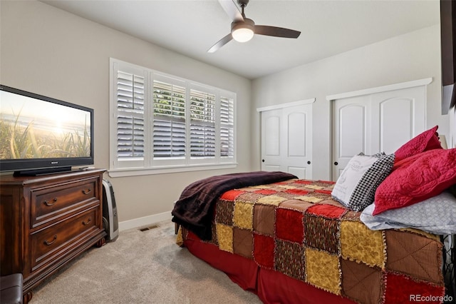 3125 Brunner Blvd, Johnstown, CO 80534 - carpeted bedroom featuring two closets and a ceiling fan