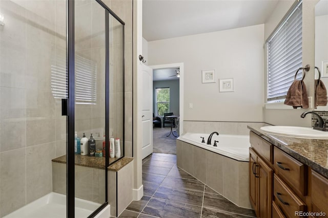 3125 Brunner Blvd, Johnstown, CO 80534 - bathroom featuring a shower stall, a garden tub, and vanity