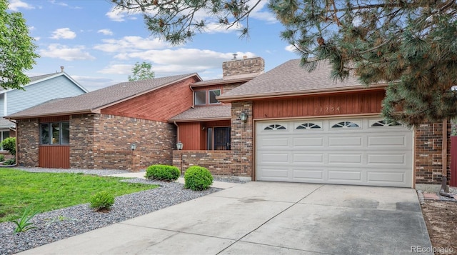 11254 E Colorado Dr, Aurora, CO 80012 - mid-century inspired home featuring brick siding, concrete driveway, a garage, a chimney, and a shingled roof