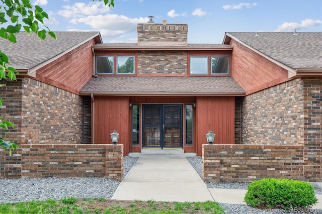 11254 E Colorado Dr, Aurora, CO 80012 - doorway to property with a chimney and a shingled roof