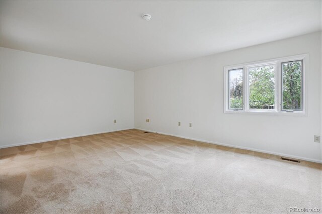 11254 E Colorado Dr, Aurora, CO 80012 - unfurnished room with light colored carpet and a smoke detector