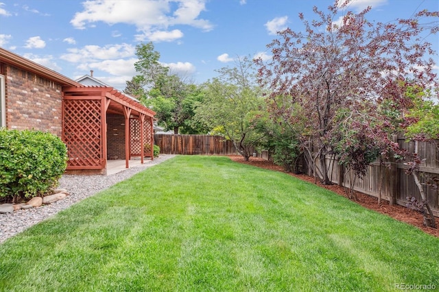 11254 E Colorado Dr, Aurora, CO 80012 - fenced backyard with a patio area and a pergola