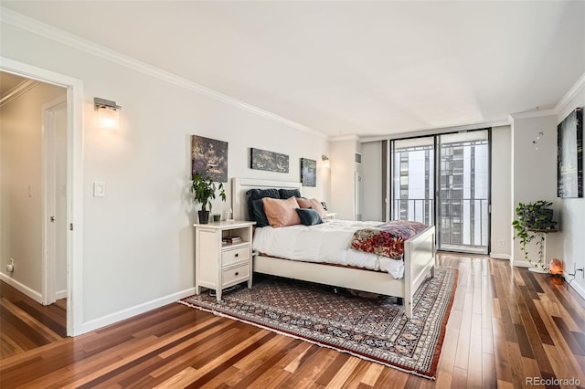 bedroom with hardwood / wood-style flooring, ornamental molding, access to exterior, and floor to ceiling windows