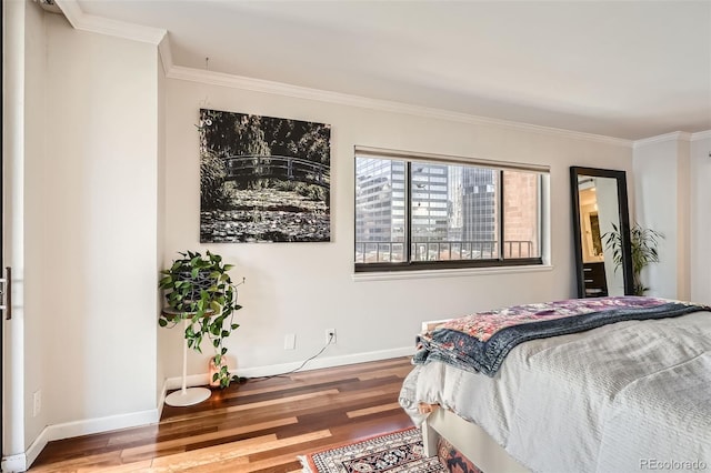 bedroom with ornamental molding and hardwood / wood-style floors