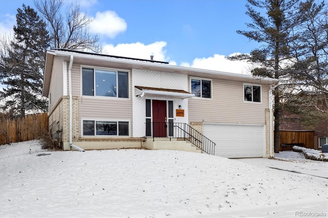 bi-level home featuring a garage