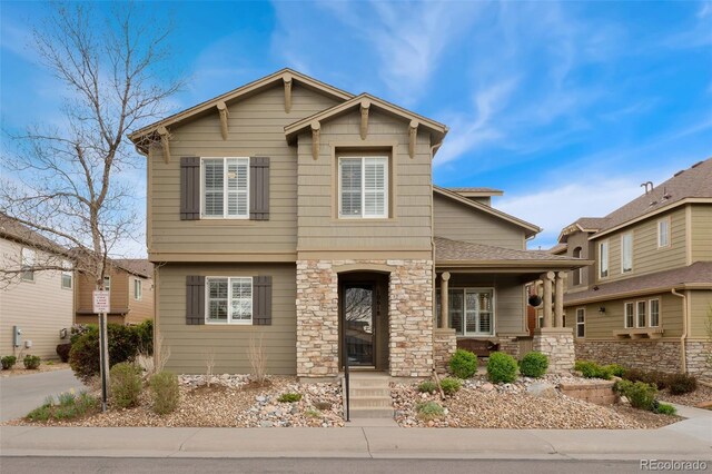 10618 Clearview Ln, Highlands Ranch, CO 80126 - view of front of home featuring a porch and stone siding